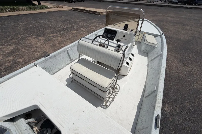 Slide: The Image of 2004 Kenner 180VX Tunnel boat with white interior and steering console. - 19