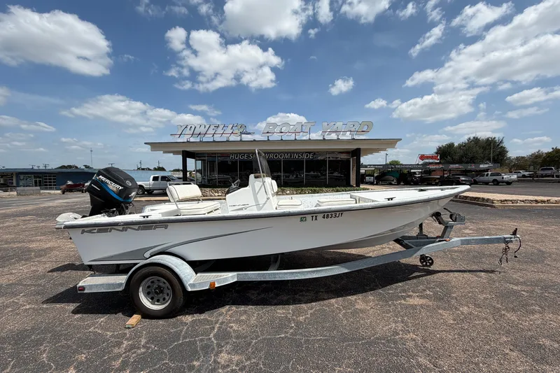 The Image of 2004 Kenner 180VX Tunnel boat on trailer at Yowell's Boat Yard under a blue sky. - 0