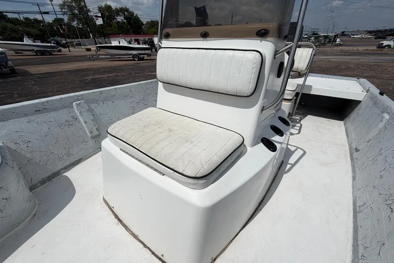 Slide: The Image of 2004 Kenner 180VX Tunnel boat interior with cushioned seating and console. - 16