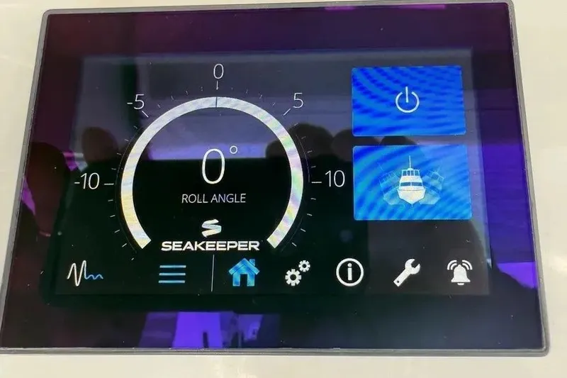 Slide: The Image of Seakeeper control panel on 2024 Boston Whaler 380 Outrage, displaying roll angle and settings. - 26