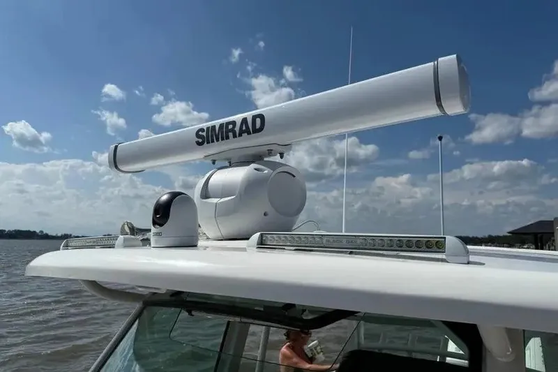 Slide: The Image of 2024 Boston Whaler 380 Outrage with Simrad radar system on a sunny day. - 21