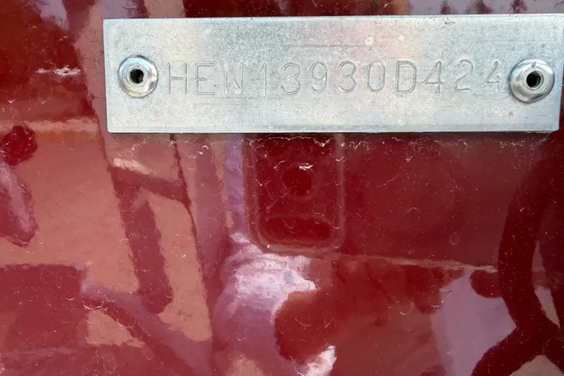 Slide: The Image of 2024 Hewescraft 210 Sea Runner ET hull identification number on red surface. - 20