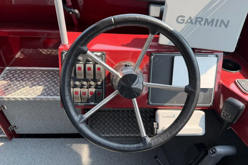 Slide: The Image of Steering wheel and controls of 2024 Hewescraft 210 Sea Runner ET boat. - 7