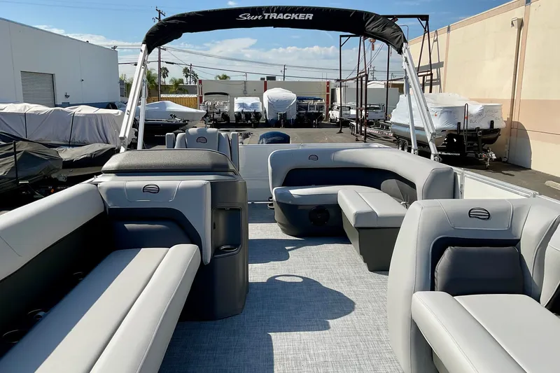 Slide: The Image of 2026 Sun Tracker Party Barge 18 DLX pontoon boat with spacious seating and modern design. - 17