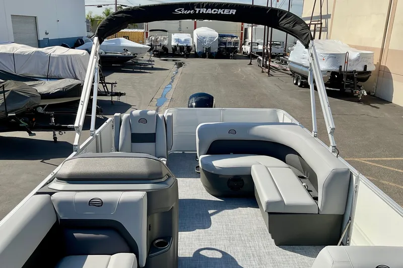 Slide: The Image of 2026 Sun Tracker Party Barge 18 DLX pontoon boat with spacious seating and modern design. - 16