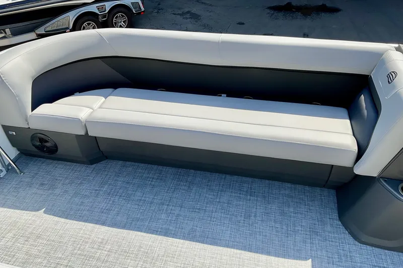 Slide: The Image of 2026 Sun Tracker Party Barge 18 DLX interior seating with gray upholstery and spacious design. - 14