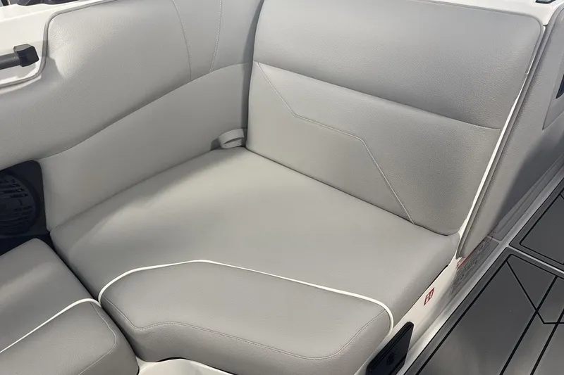 Slide: The Image of 2027 Moomba Max boat interior with sleek gray seating and modern design. - 17