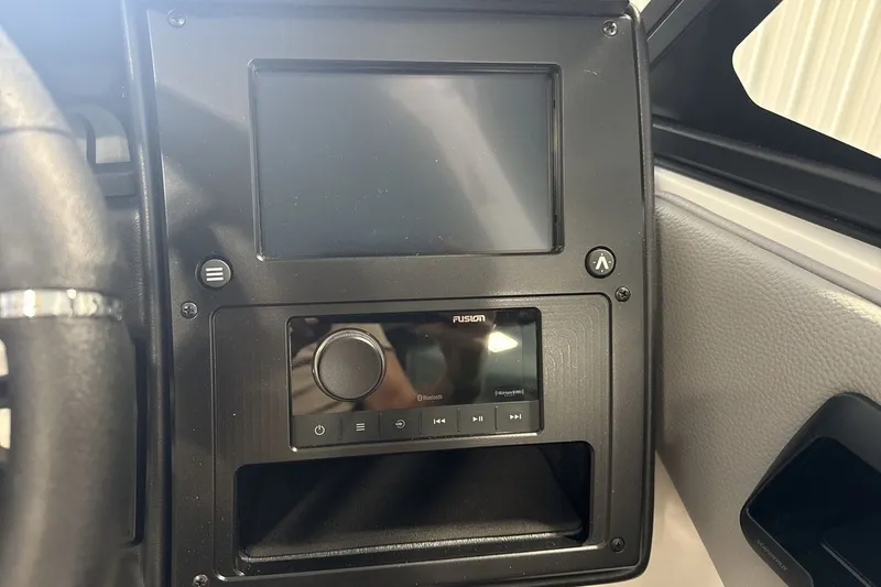 Slide: The Image of Dashboard of 2027 Moomba Max boat featuring a touchscreen and Fusion audio system. - 15