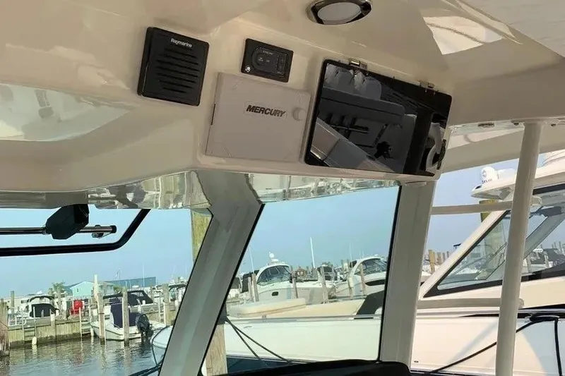 Slide: The Image of Interior view of a 2019 Boston Whaler 380 Outrage boat with electronic controls. - 19