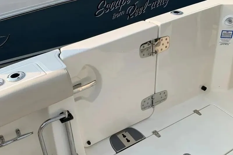 Slide: The Image of 2019 Boston Whaler 380 Outrage boat deck with stainless steel fittings and secure hinges. - 22