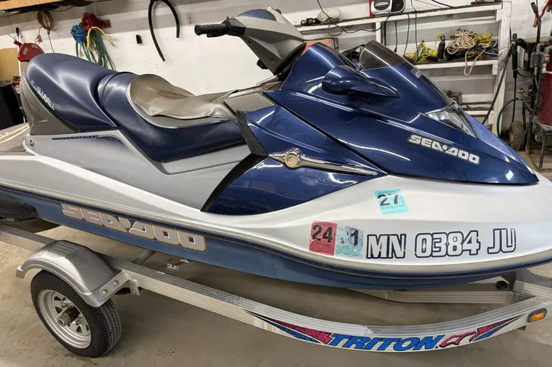 Slide: The Image of 2004 Sea-Doo GTX 4-TEC Supercharged jet ski on a trailer in a garage. - 3