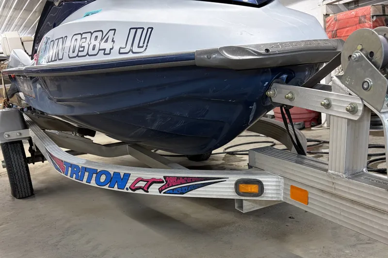 Slide: The Image of 2004 Sea-Doo GTX 4-TEC Supercharged on Triton trailer in garage setting. - 5
