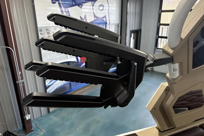 Slide: The Image of Close-up of 2027 Supra SL 550 boat's wakeboard rack in a showroom. - 58
