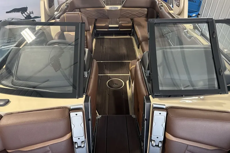 Slide: The Image of Luxurious interior of 2027 Supra SL 550 boat with brown leather seating and sleek design. - 36