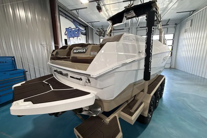 Slide: The Image of 2027 Supra SL 550 boat in a showroom, featuring sleek design and modern amenities. - 41