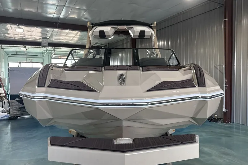 Slide: The Image of 2027 Supra SL 550 boat in a modern indoor showroom. - 44