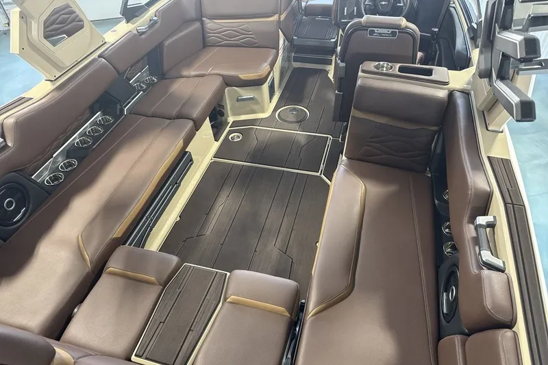 Slide: The Image of Luxurious interior of 2027 Supra SL 550 boat with brown leather seating and modern design. - 46