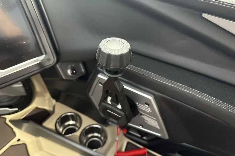Slide: The Image of 2027 Supra SL 550 interior, featuring a modern control panel and cup holders. - 52