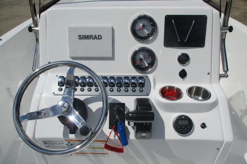 Slide: The Image of 2019 Hurricane SunDeck Sport CC 231 OB boat dashboard with steering wheel and controls. - 3