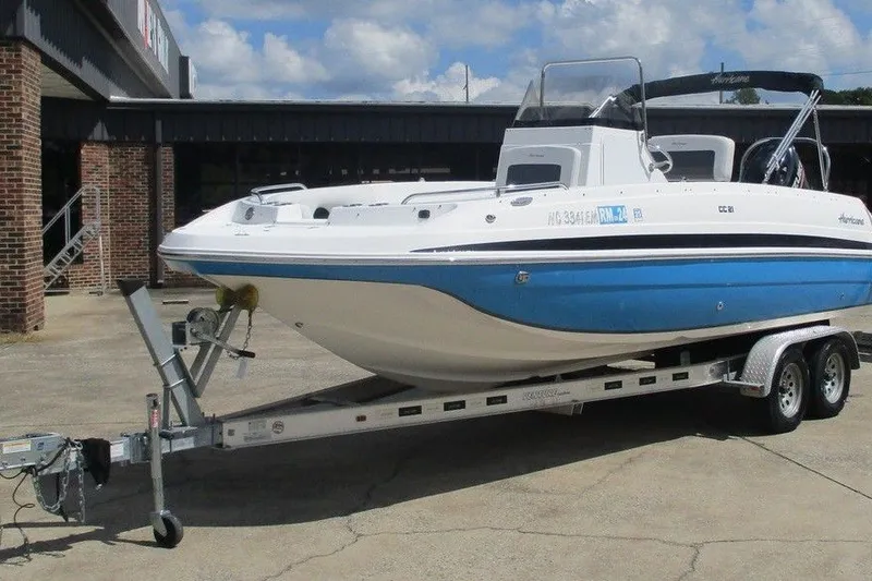 Slide: The Image of 2019 Hurricane SunDeck Sport CC 231 OB boat on trailer, parked outdoors. - 5