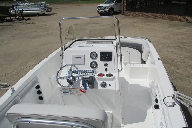 Slide: The Image of 2019 Hurricane SunDeck Sport CC 231 OB boat interior with steering console and seating. - 6