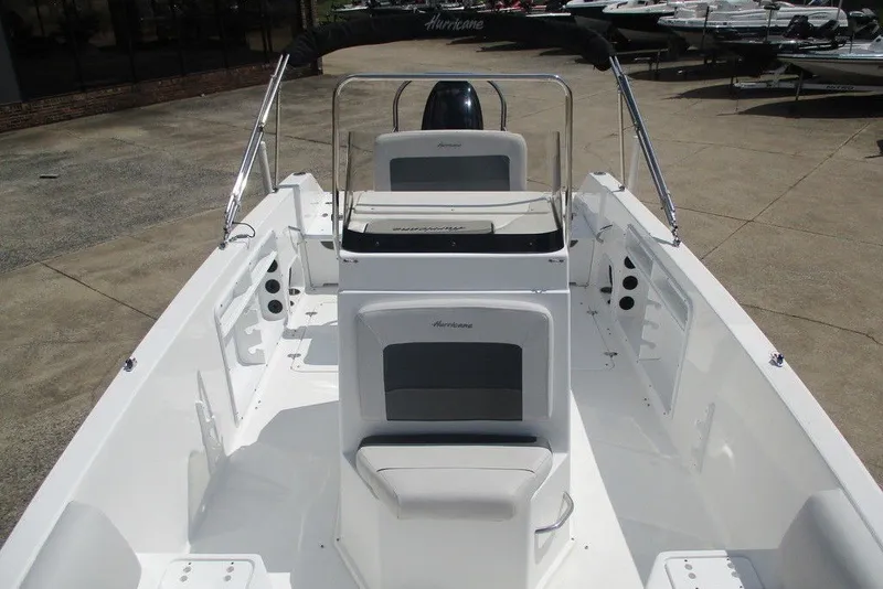 Slide: The Image of 2019 Hurricane SunDeck Sport CC 231 OB boat interior, featuring seating and console. - 4