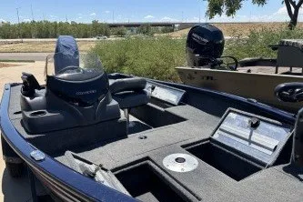 Slide: The Image of 2026 Tracker Super Guide V-16 SC boat with modern dashboard and seating. - 48