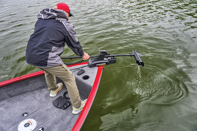 Slide: The Image of Manufacturer Provided Image: Man operating trolling motor on 2026 Tracker Super Guide V-16 SC boat. - 45