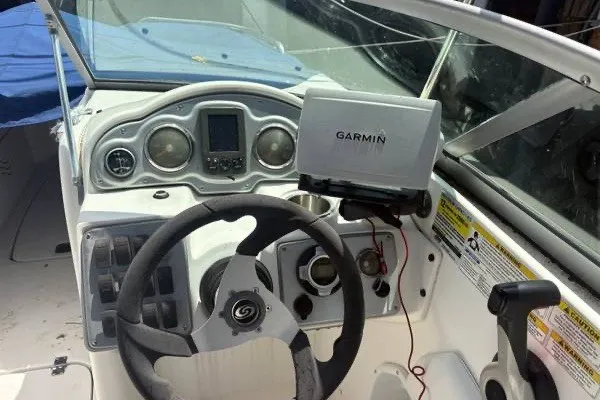 Slide: The Image of 2013 Hurricane SunDeck 2400 OB boat dashboard with Garmin navigation system. - 5