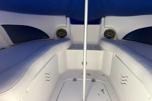 Slide: The Image of Interior view of a 2013 Hurricane SunDeck 2400 OB boat with cushioned seating. - 4
