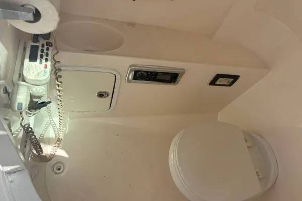 Slide: The Image of Interior of a 2013 Hurricane SunDeck 2400 OB boat with communication equipment. - 6