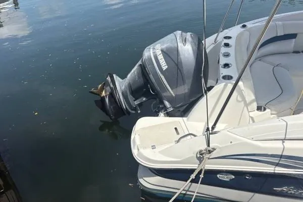 Slide: The Image of 2013 Hurricane SunDeck 2400 OB boat with Yamaha outboard motor on calm water. - 3