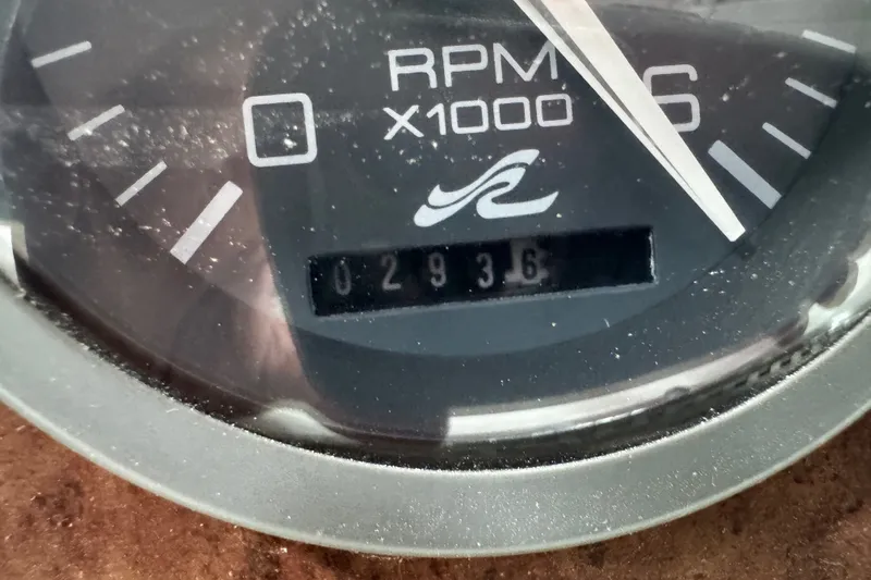 Slide: The Image of Close-up of a 1994 Sea Ray 300 Sundancer RPM gauge showing 2936 hours. - 17