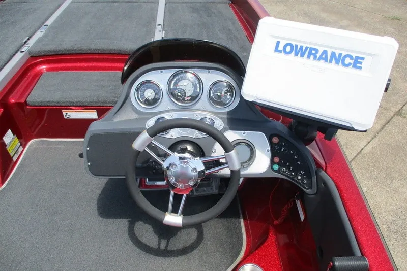 Slide: The Image of 2008 Ranger Z19 Comanche boat dashboard with steering wheel and Lowrance fish finder. - 4