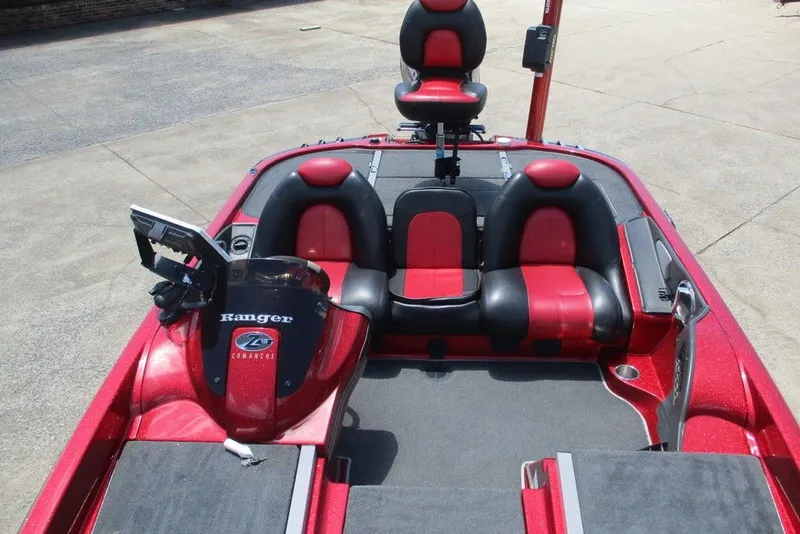 Slide: The Image of 2008 Ranger Z19 Comanche boat interior with red and black seating, steering console, and fishing seat. - 5