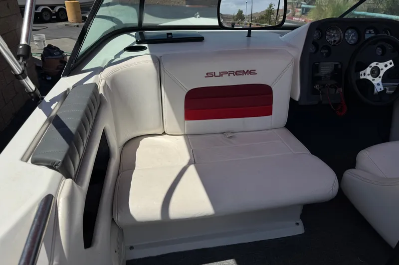 Slide: The Image of 1991 Ski Supreme MS Tournament Series boat interior with white seating and dashboard. - 13