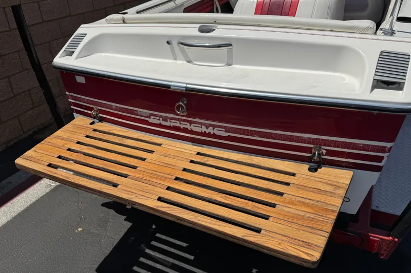 Slide: The Image of Rear view of a 1991 Ski Supreme MS Tournament Series boat with wooden swim platform. - 6