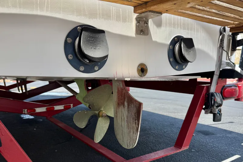 Slide: The Image of 1991 Ski Supreme MS Tournament Series boat propeller and exhaust on red trailer. - 7