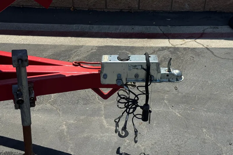 Slide: The Image of Trailer hitch of a 1991 Ski Supreme MS Tournament Series on asphalt pavement. - 21