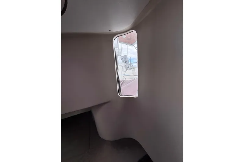 Slide: The Image of Interior view of a 1993 Beneteau Oceanis 400 sailboat through a cabin window. - 23