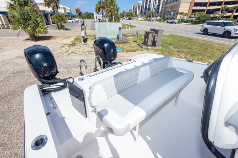 Slide: The Image of 2022 Twin Vee 240 GFX CC boat with dual Mercury engines and cushioned seating. - 54