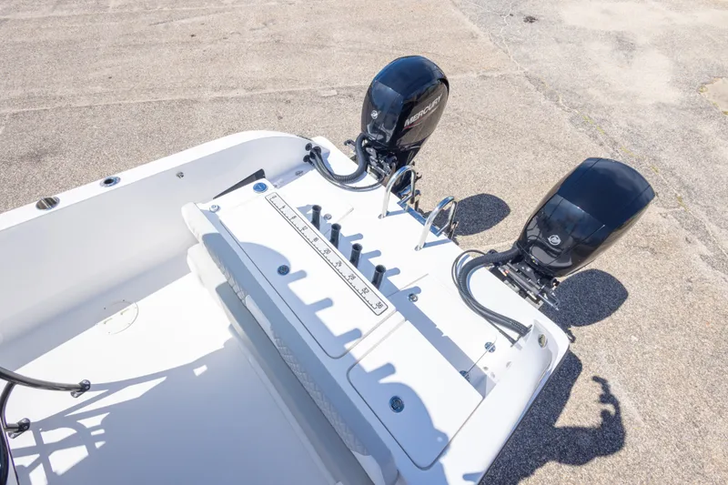 Slide: The Image of 2022 Twin Vee 240 GFX CC boat with dual Mercury outboard engines, viewed from above. - 57