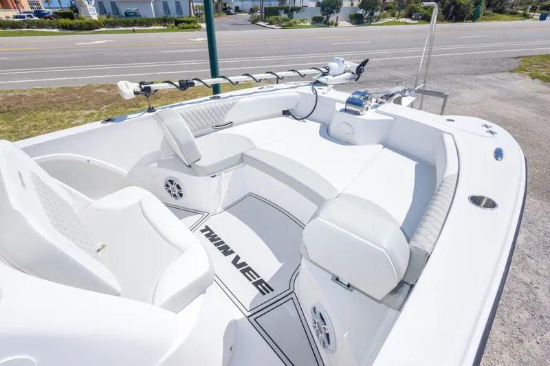 Slide: The Image of 2022 Twin Vee 240 GFX CC boat interior with white seating and modern design. - 39