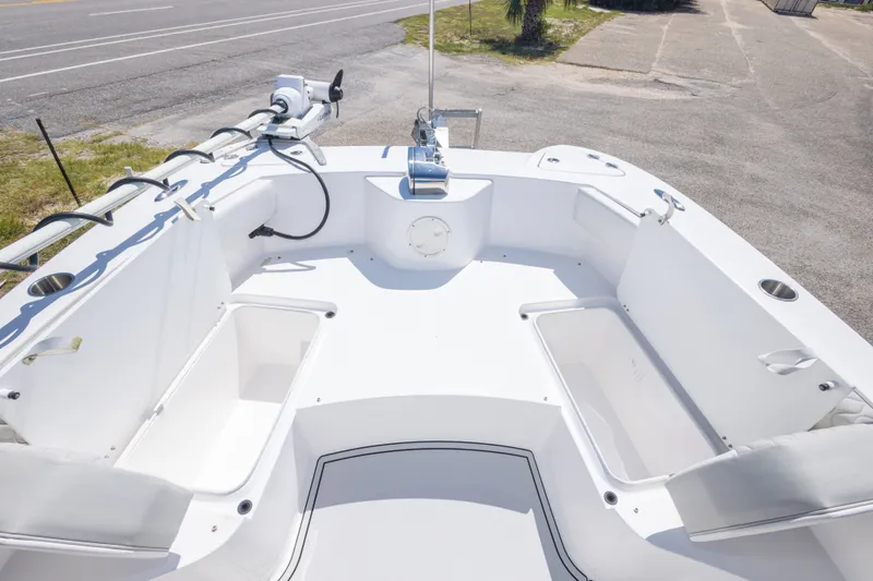 Slide: The Image of 2022 Twin Vee 240 GFX CC boat interior with spacious seating and storage compartments. - 45
