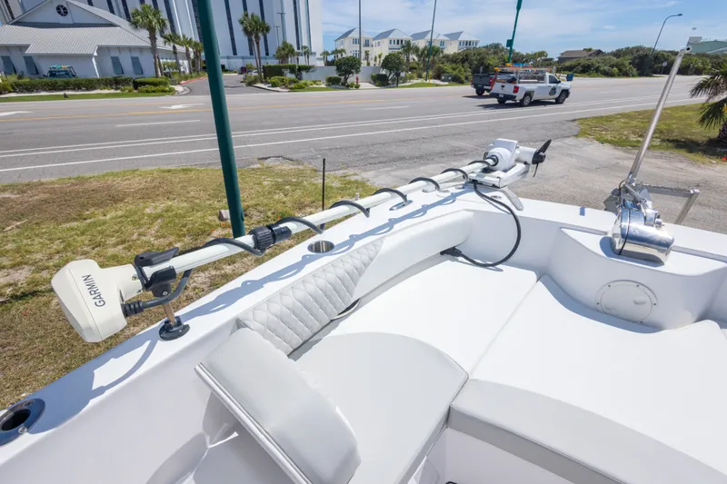 Slide: The Image of 2022 Twin Vee 240 GFX CC boat with Garmin equipment, parked near a road. - 41