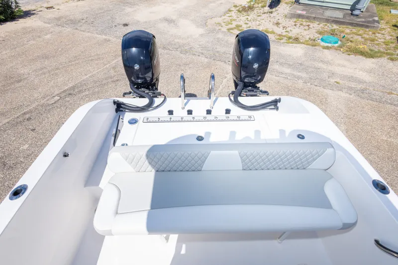 Slide: The Image of 2022 Twin Vee 240 GFX CC boat with dual engines and cushioned seating. - 53