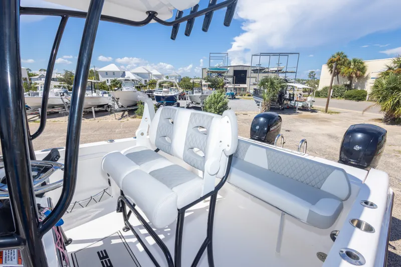 Slide: The Image of 2022 Twin Vee 240 GFX CC boat interior with seating and dual engines. - 51