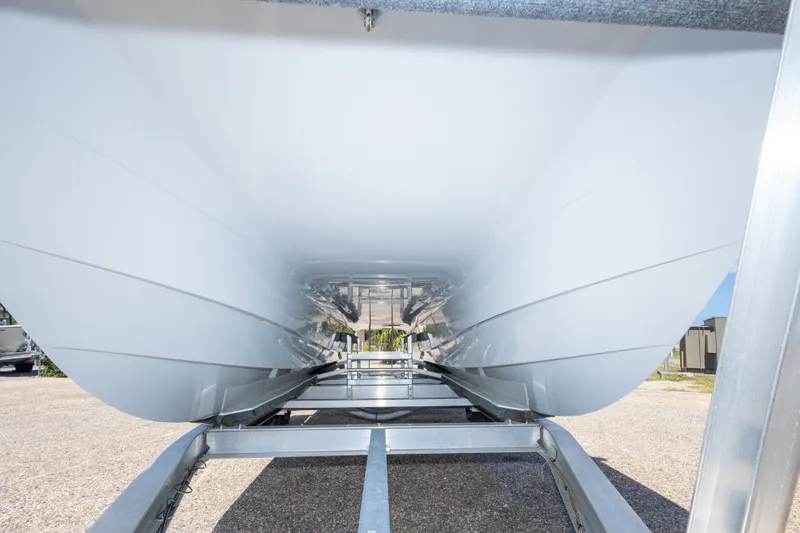 Slide: The Image of Underneath view of 2022 Twin Vee 240 GFX CC boat hull on trailer. - 25