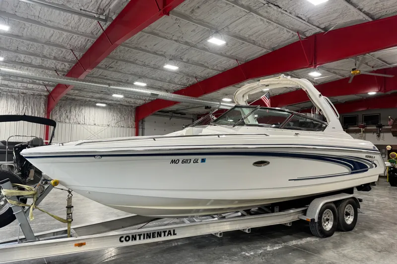 Slide: The Image of 2005 Formula 280 Bowrider boat on trailer in indoor storage facility. - 2