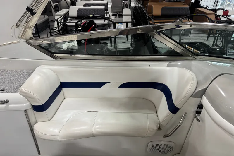 Slide: The Image of 2005 Formula 280 Bowrider interior with white and blue seating, showcasing luxury design. - 9
